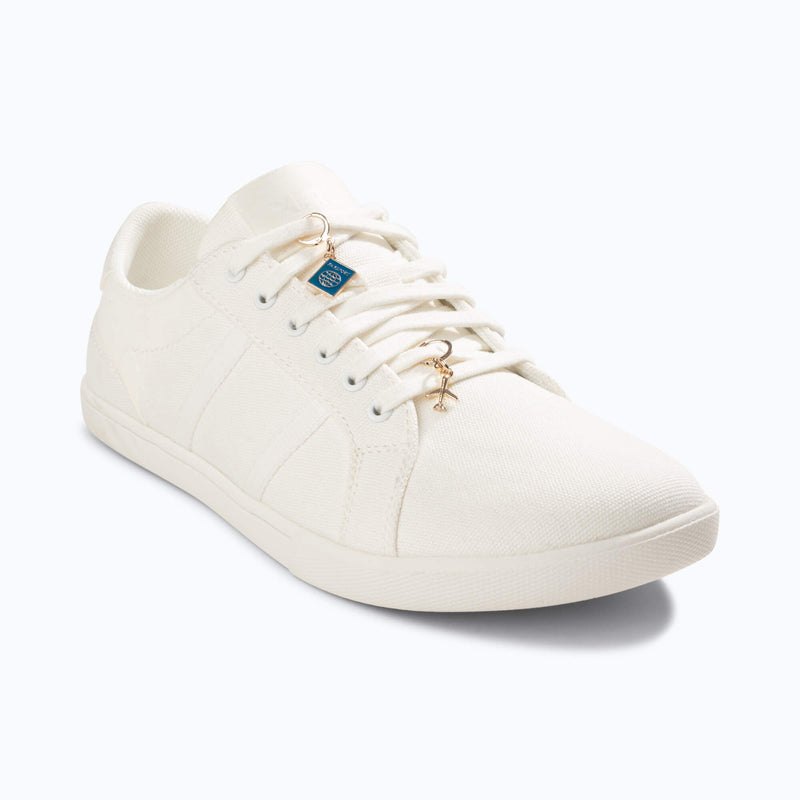 Xero Shoes White Shoe with Travel-Themed Shoe Charm and Toe Facing to the Right