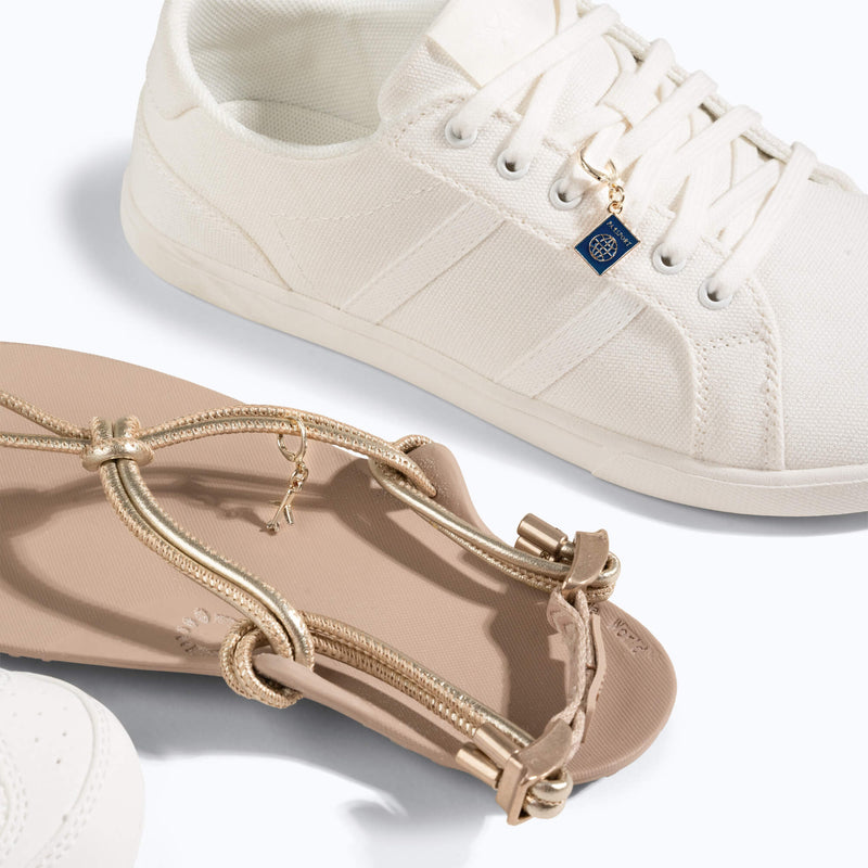 Xero Shoes Travel-Themed Shoe Charm in a White Shoe and Tan Sandal