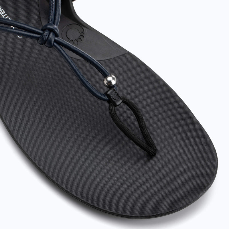 Xero Shoes Literary Sport Genesis Black Sandal with a Top-down Close-up view Highlighting the Toe Post and Strap Details.