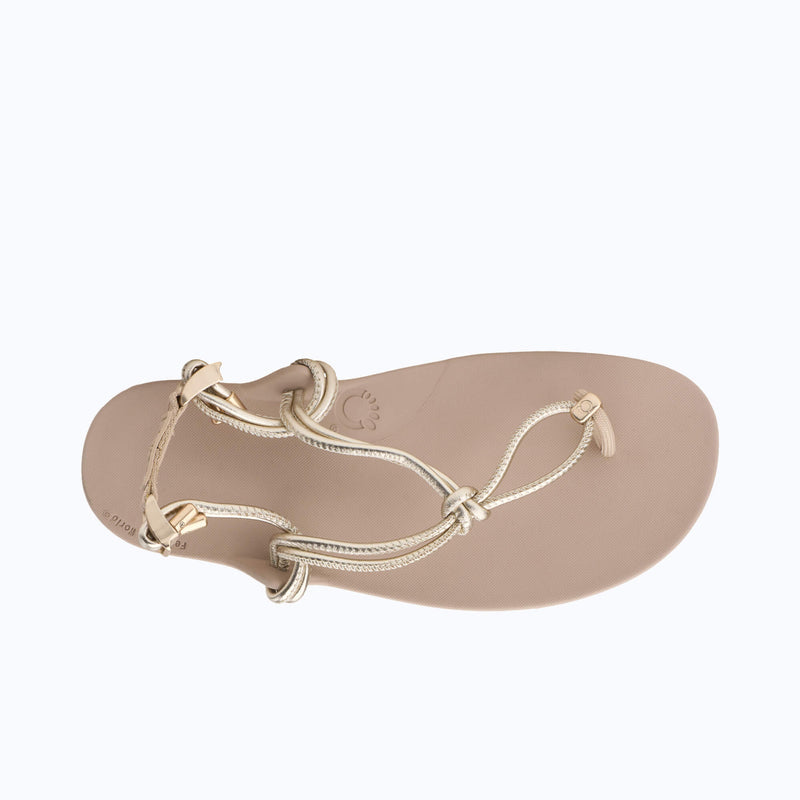 Xero Shoes Genesis Leather Women Sandal in Beige with Gold Strap Top View and Toe Facing Right