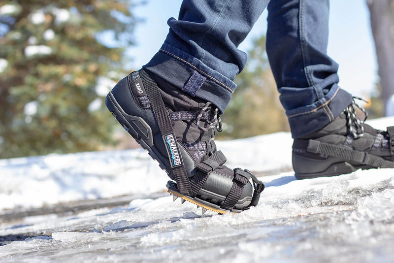 Xero Shoes Icewalkers in Black Boots with Toe Stepping on the Ice