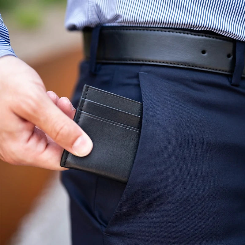 Full-Grain Leather Wallet in Obsidian showed with matching belt