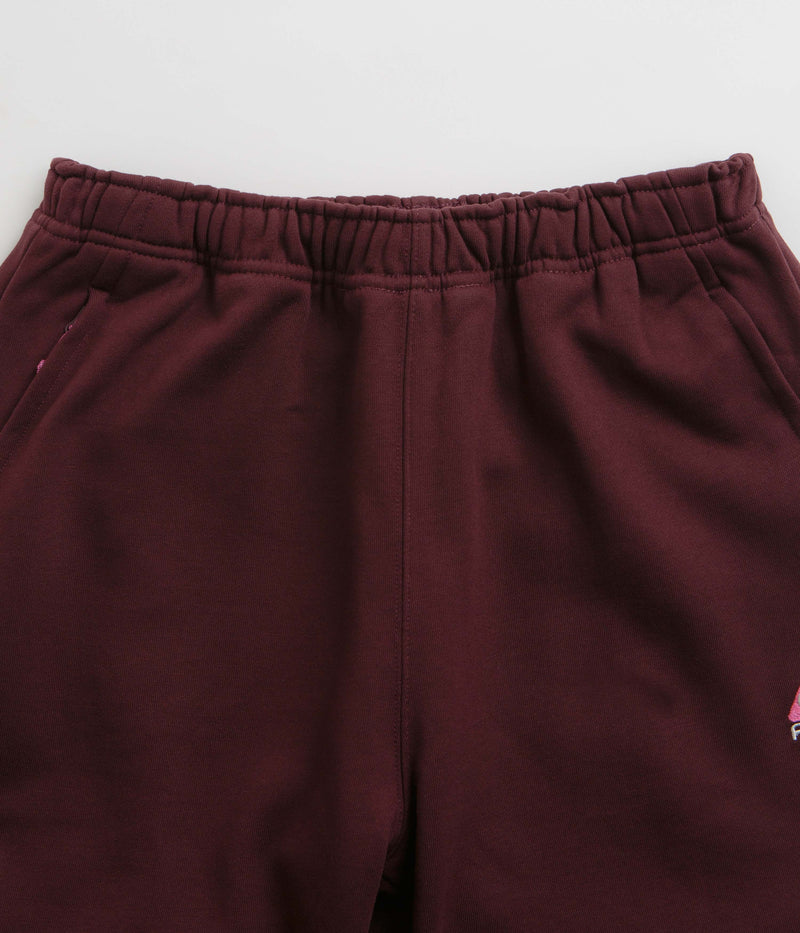 Nike ACG Tuff Fleece Lungs Pants in Burgundy Crush and Laser Fuchsia