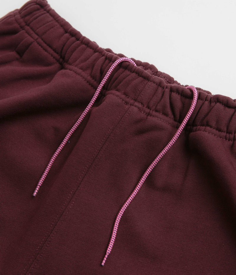 Nike ACG Tuff Fleece Lungs Pants in Burgundy Crush and Laser Fuchsia