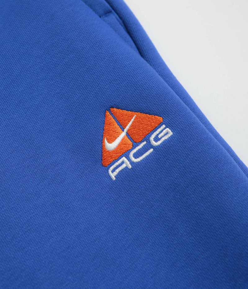Nike ACG Tuff Fleece Lungs Pants in Game Royal and Safety Orange / Summit White