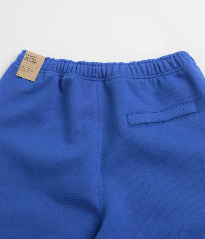 Nike ACG Tuff Fleece Lungs Pants in Game Royal and Safety Orange / Summit White