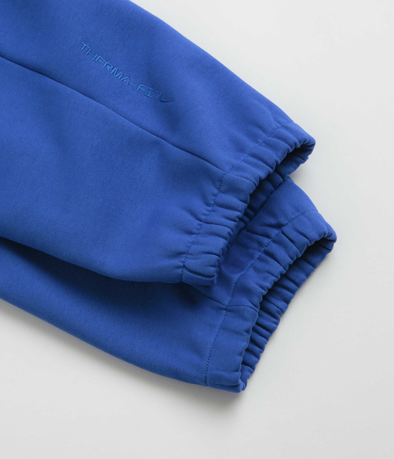 Nike ACG Tuff Fleece Lungs Pants in Game Royal and Safety Orange / Summit White