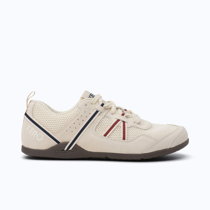 Xero Shoes Prio Men Shoe in Cream with Black and Red Strap, also a Black and Blue Chevron Design on the Side with Toe Facing Right