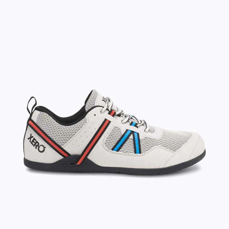 Xero Shoes Prio Men Shoe in Off-white, Featuring Black Trim, a Red Heel Strap, and a Blue and Black Chevron Design on the Side with Toe Facing Right