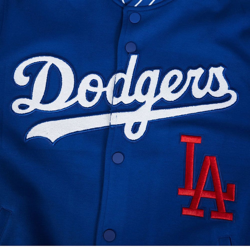 Close-Up View of the Dodgers Logo of the LOS ANGELES DODGERS MEN'S JACKET PRO GAME DAY JACKET in blue