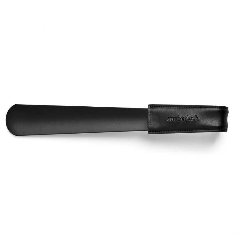 Amberjack shoe horn made with leather and stainless steel top down view