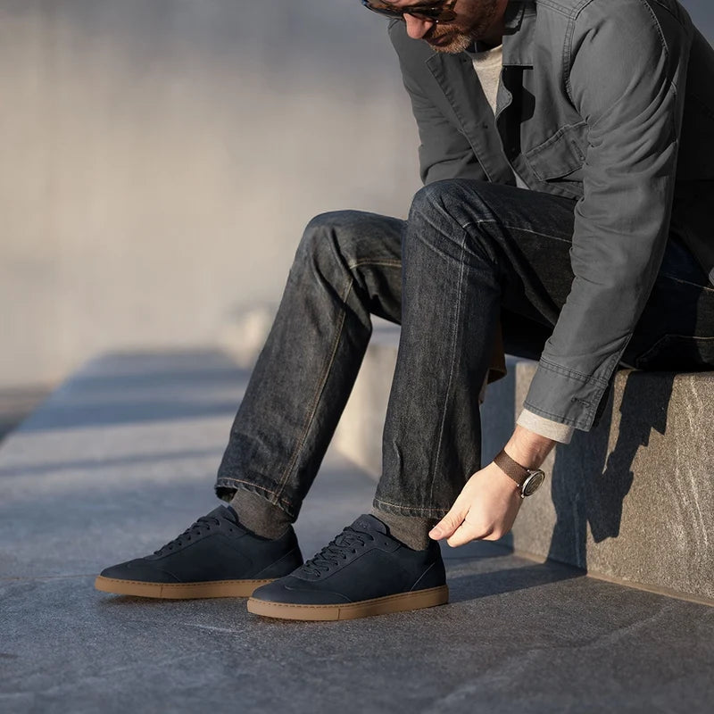 model wearing the atlas cobalt with dark jeans