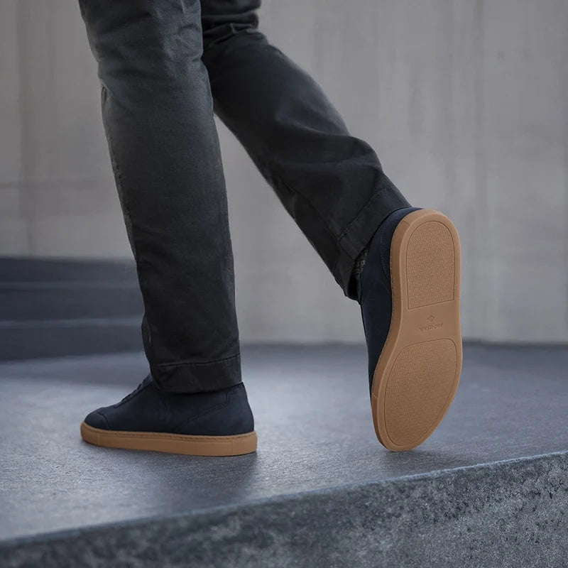 model wearing the atlas cobalt with dark jeans