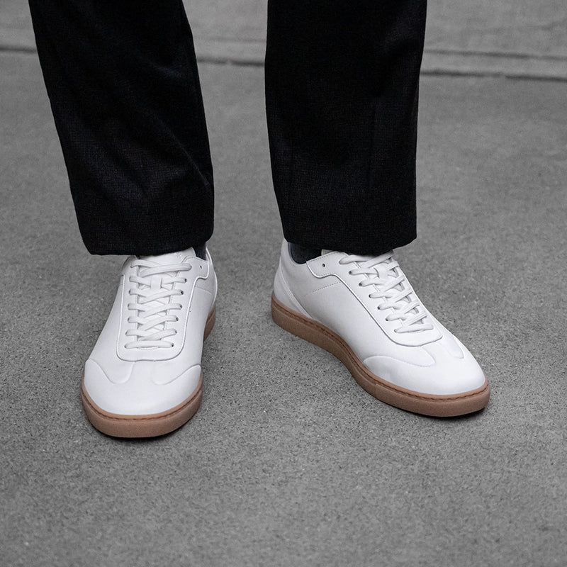 Atlas in Ivory white leather on model wearing dark pants