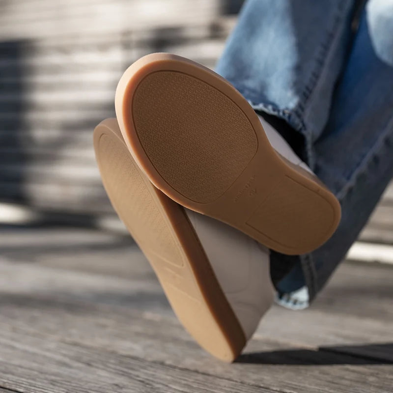 model wearing the atlas ivory with light wash jeans showing otusole