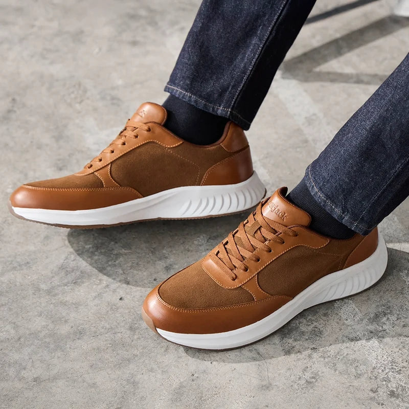 model wearing The Axis Grizzly with dark jeans and light brown sweater