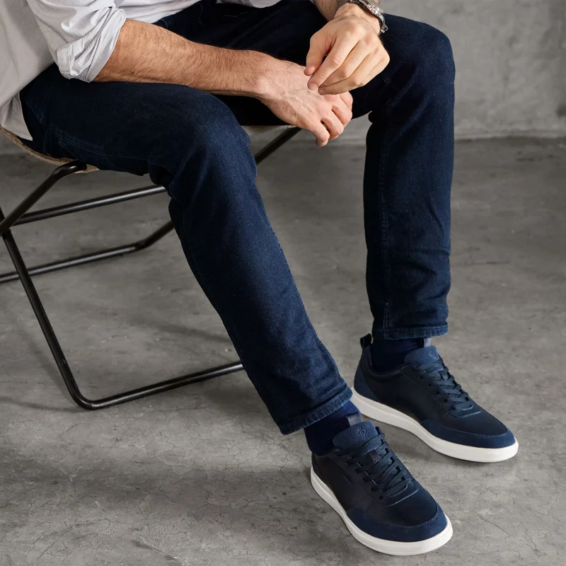 Model wearing The Court in Cobalt leather & suede with button up and jeans