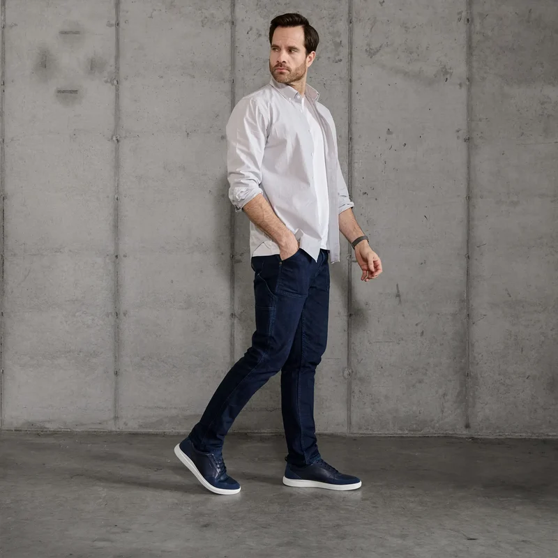 Model wearing The Court in Cobalt leather & suede with button up and jeans