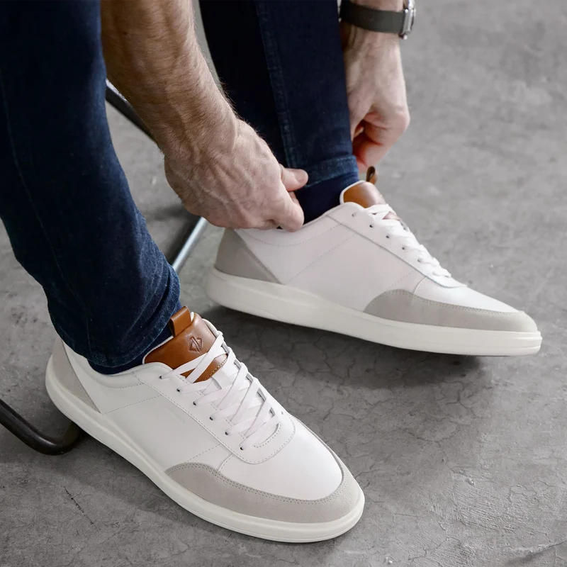 Model wearing The Court in Ivory leather & suede with jeans