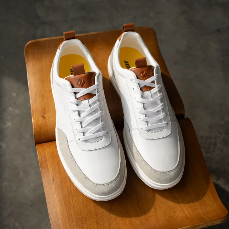 Detail shot of The Court in Ivory leather & suede on bench