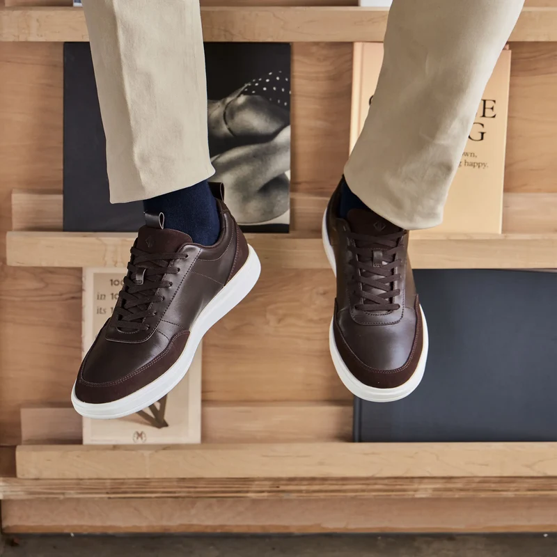 model wearing The Court in Walnut leather & suede labeled outsole