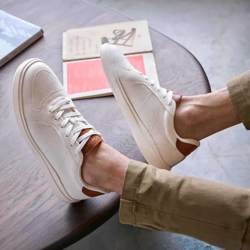 Model wearing The Drift in Ivory knit with khaki pants