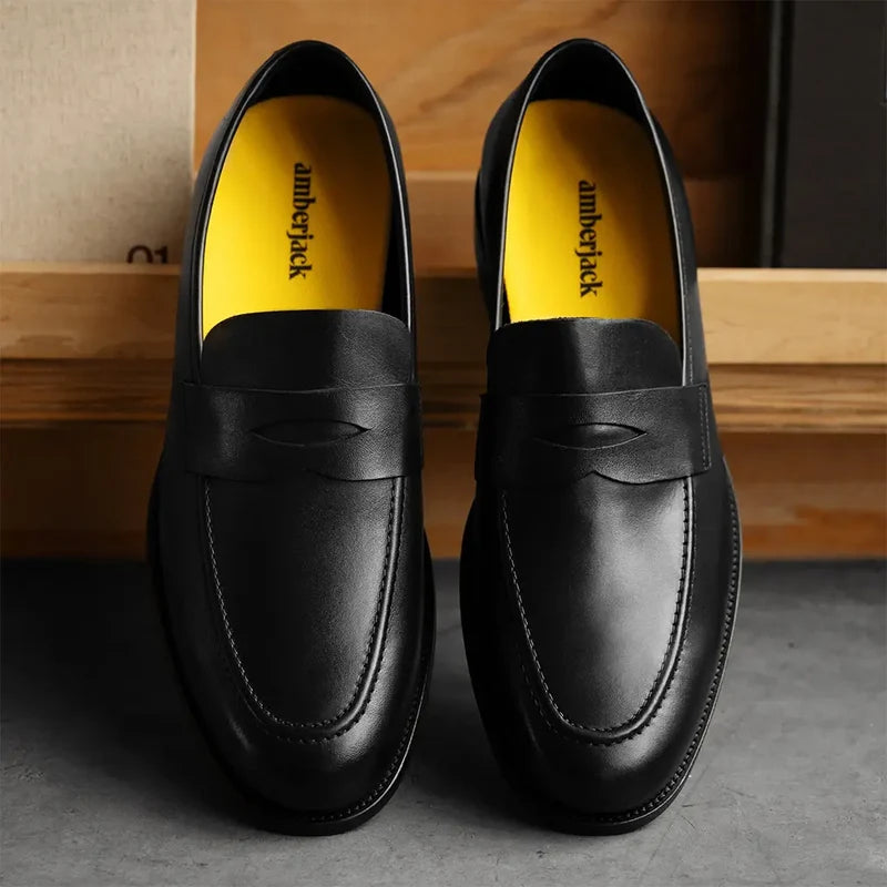The Duke in Obsidian black full-grain leather on concrete background