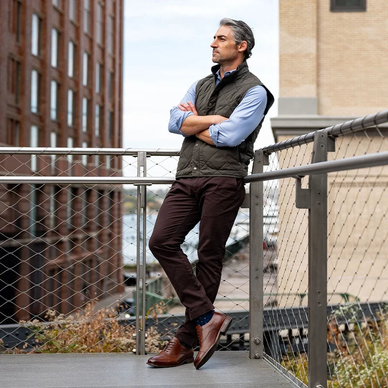 The Regent Chestnut on model with blue dress socks and dark brown chinos