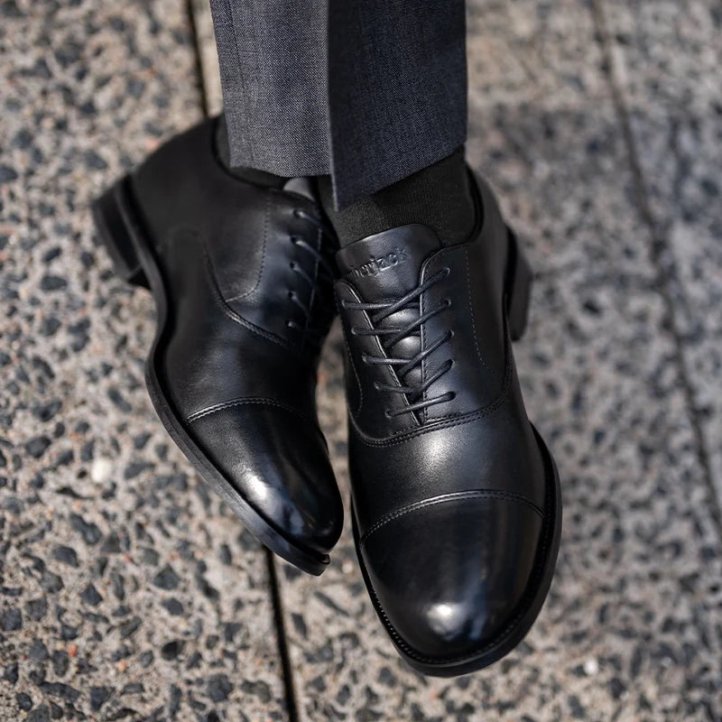 model wearing The Regent in Obsidian paired with dark gray suit