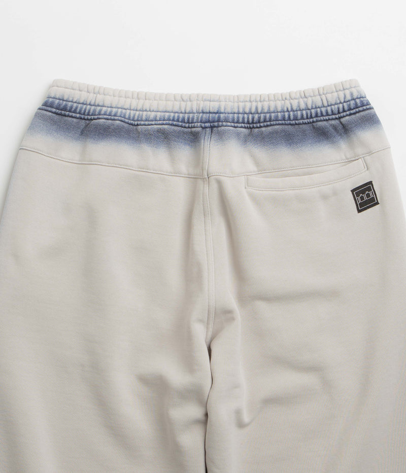 The Trilogy Tapes Overdye Open Hem Sweatpants in Grey and Blue