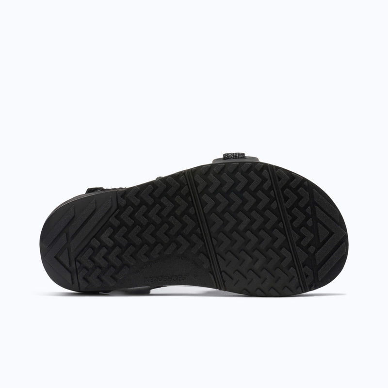 Xero Shoes Z-Trail Big Kids Sandal in Black with the outsole facing back and the toe facing right.