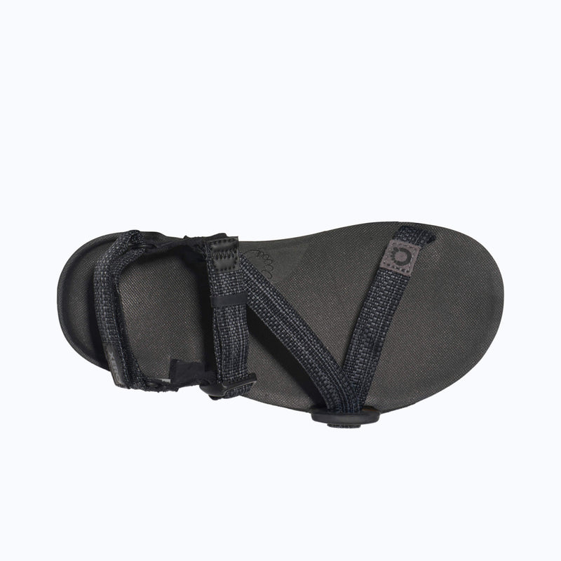 Xero Shoes Z-Trail - Big Kids Sandal in Black with Top-down View, Toe Facing Right